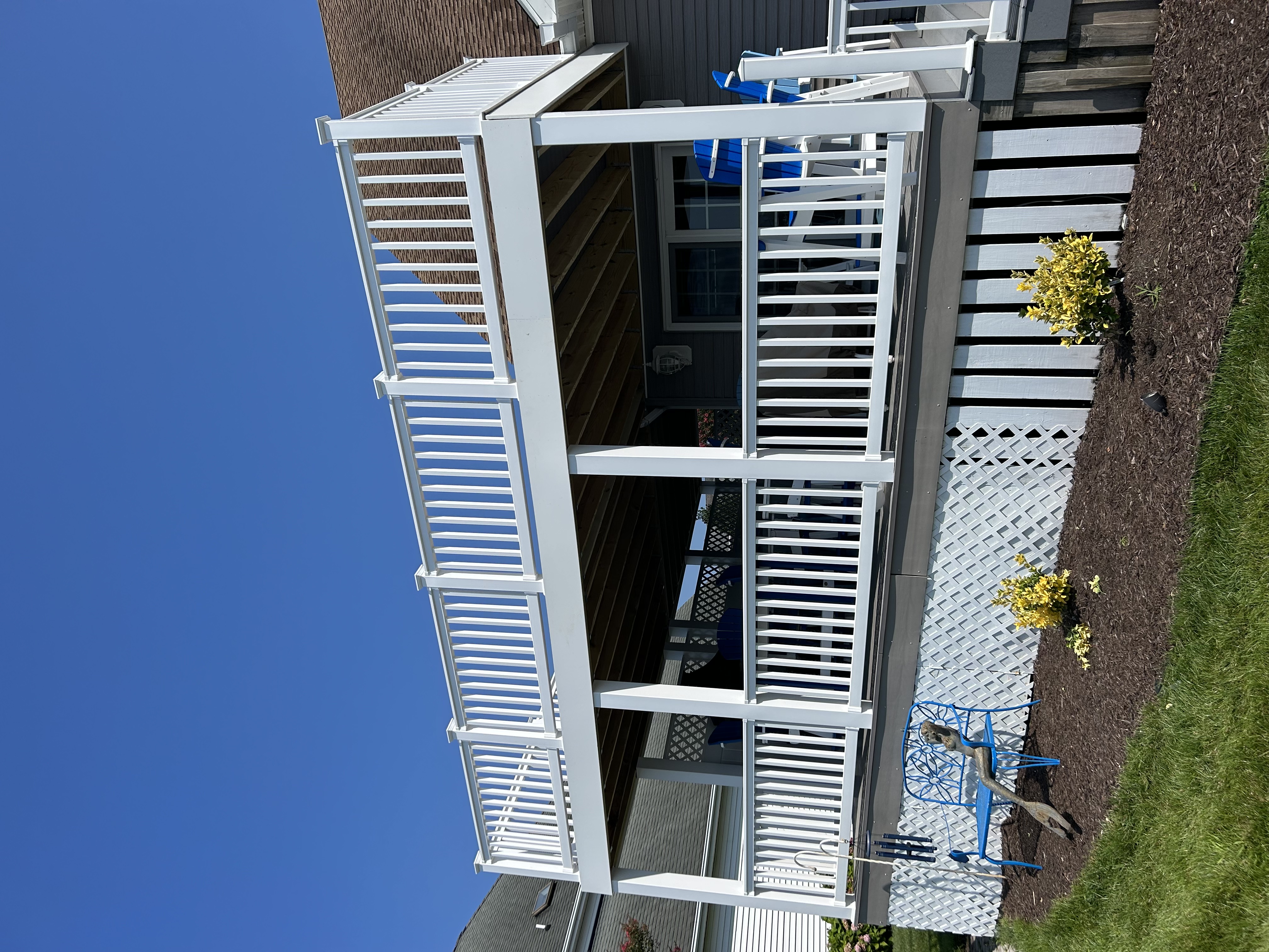 Two-level covered deck addition on a coastal home