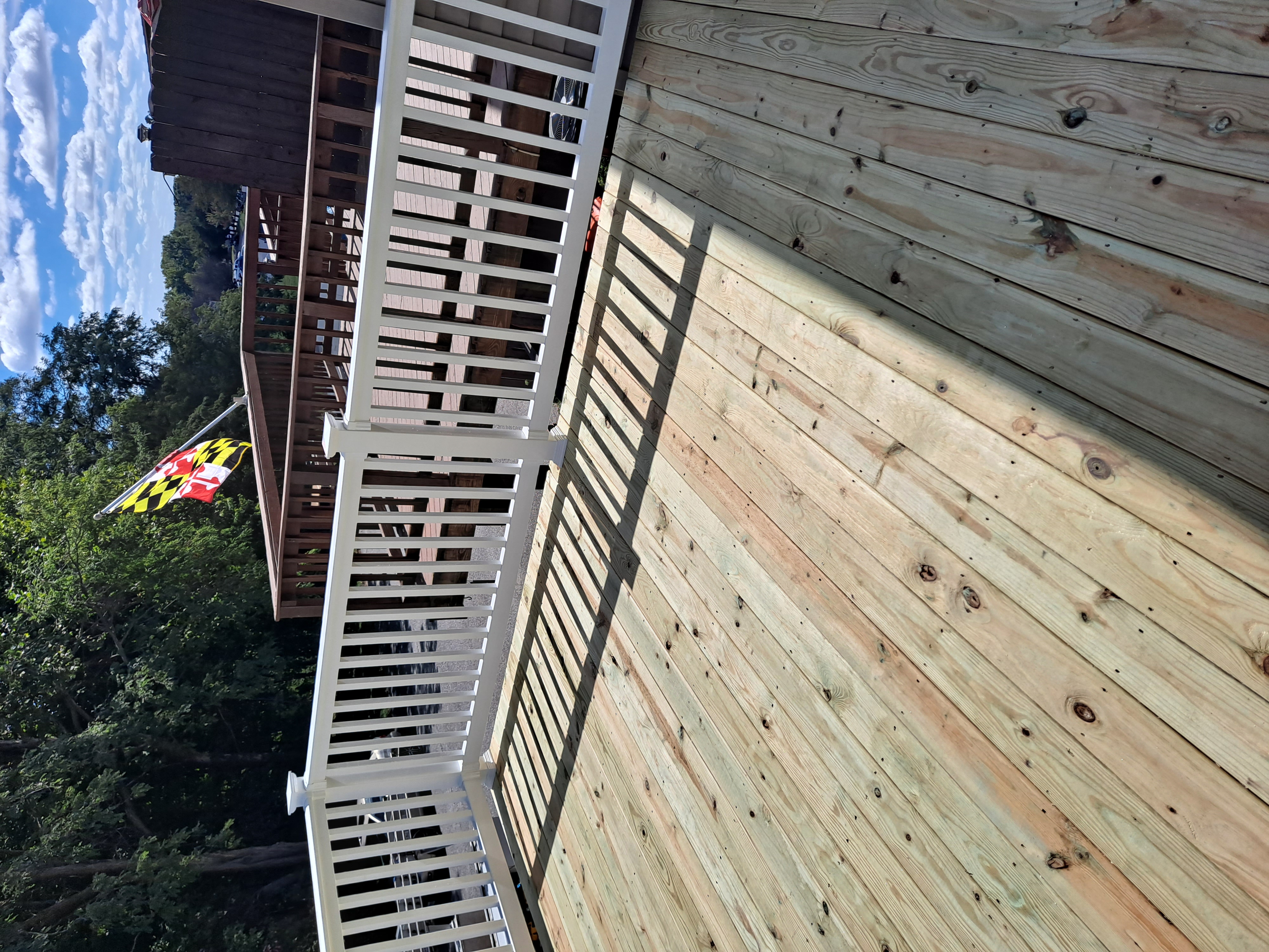 New wood deck build with a Maryland flag flying