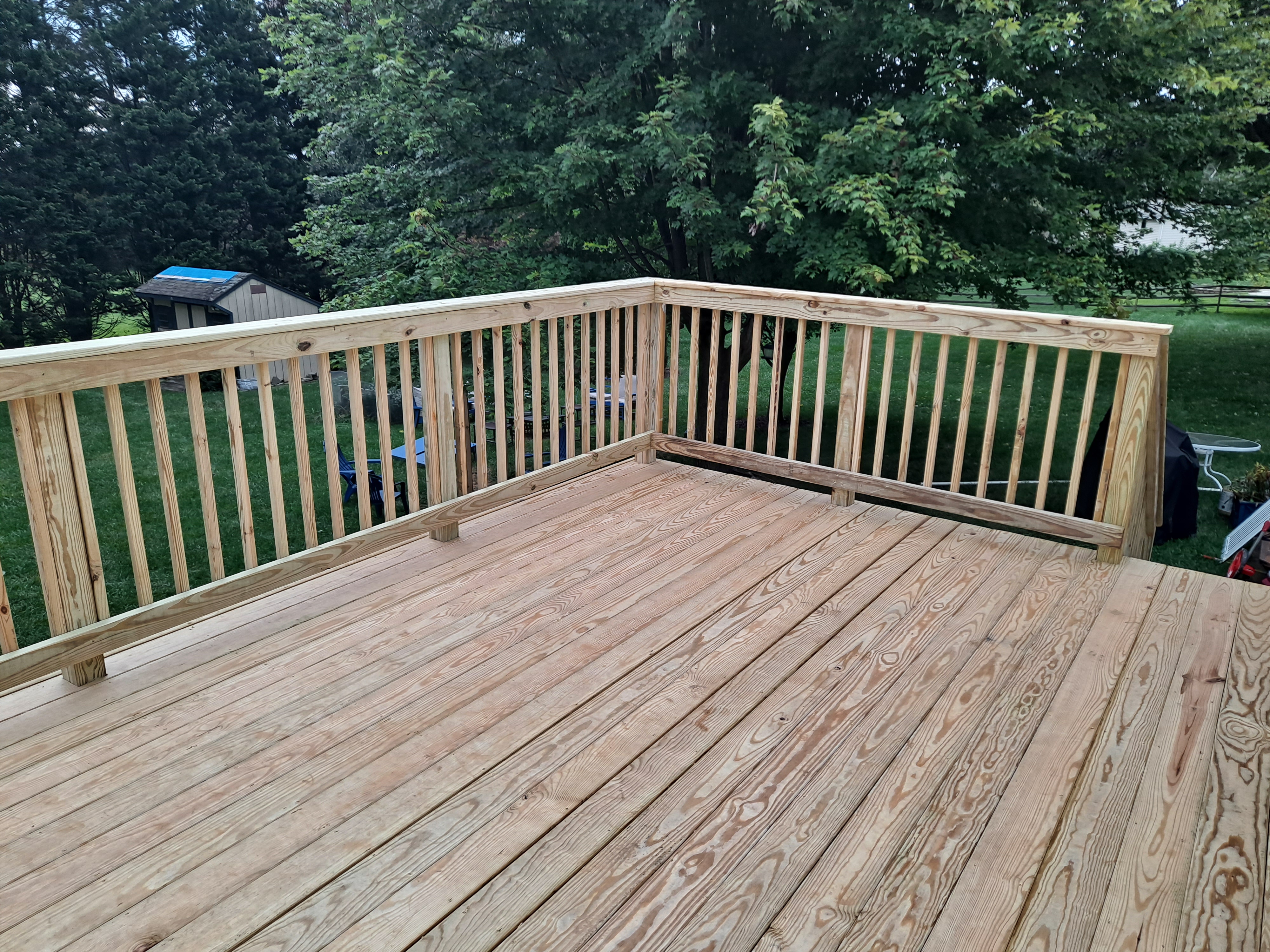 New wood deck build with fresh railing