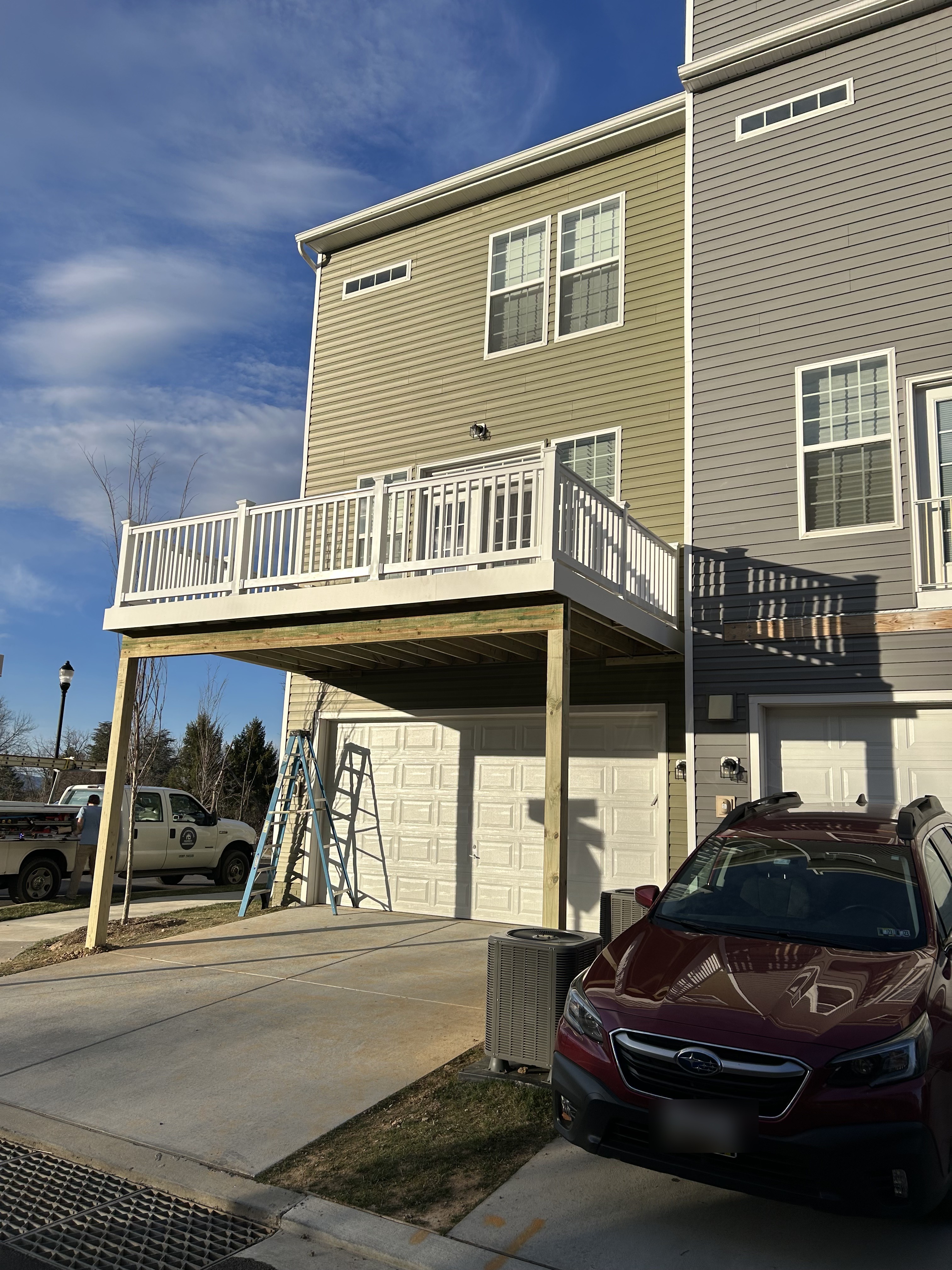 Elevated deck built over a townhome garage
