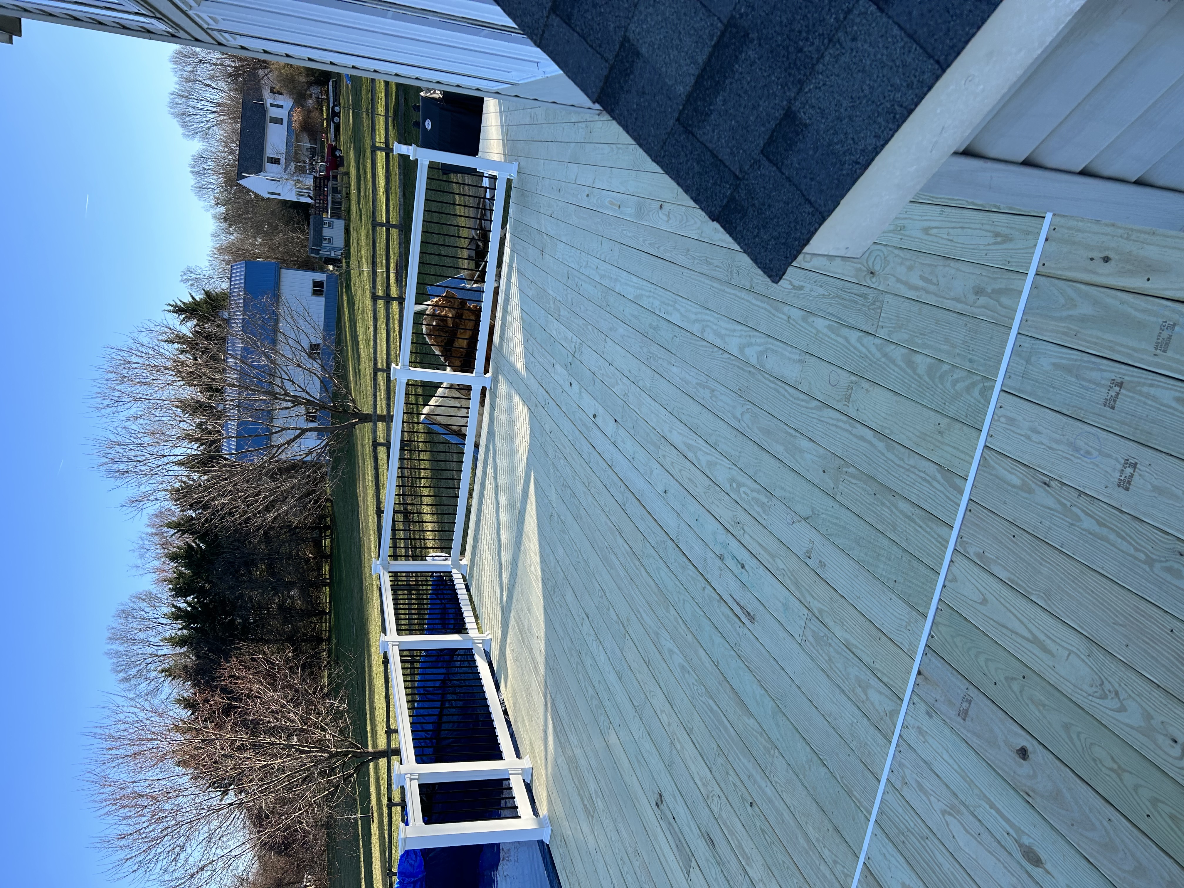 Backyard deck build with pool in a rural farm setting