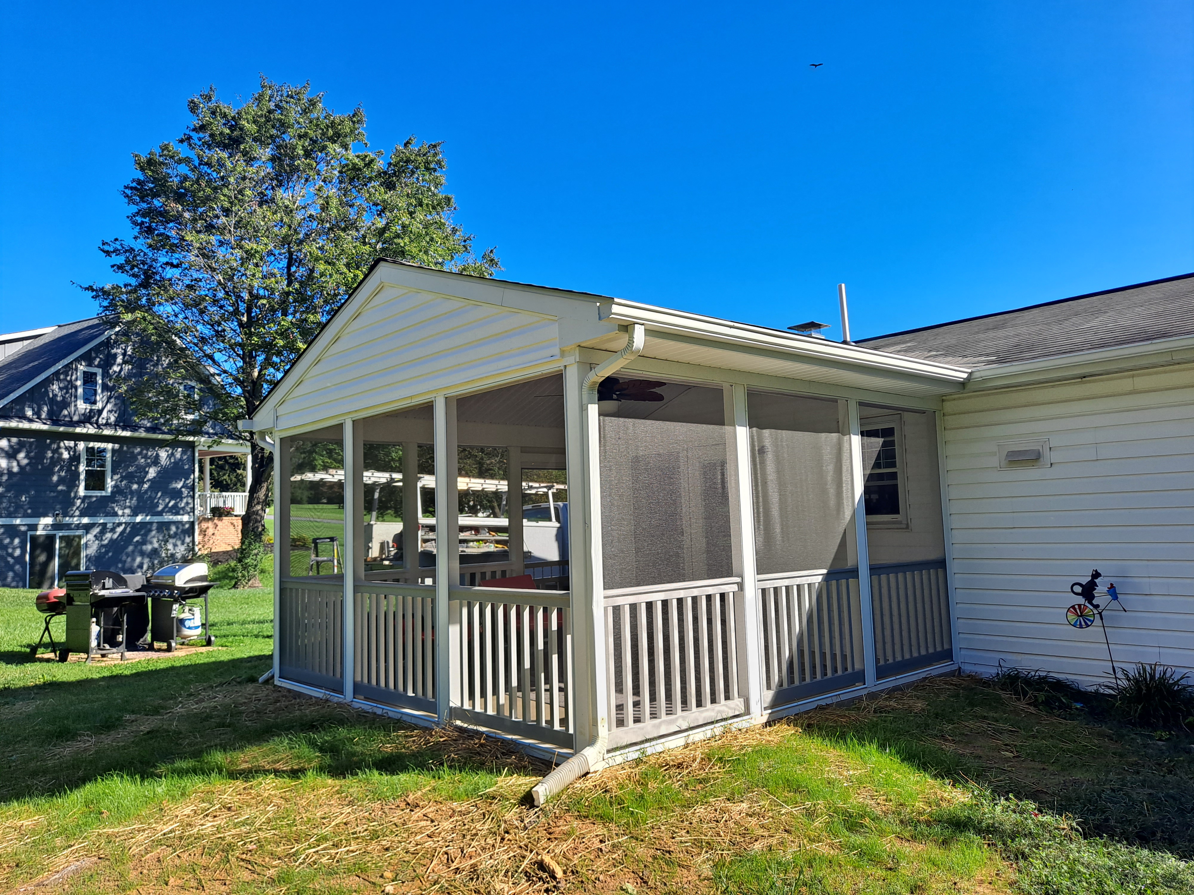 Screened porch addition on a sunny day