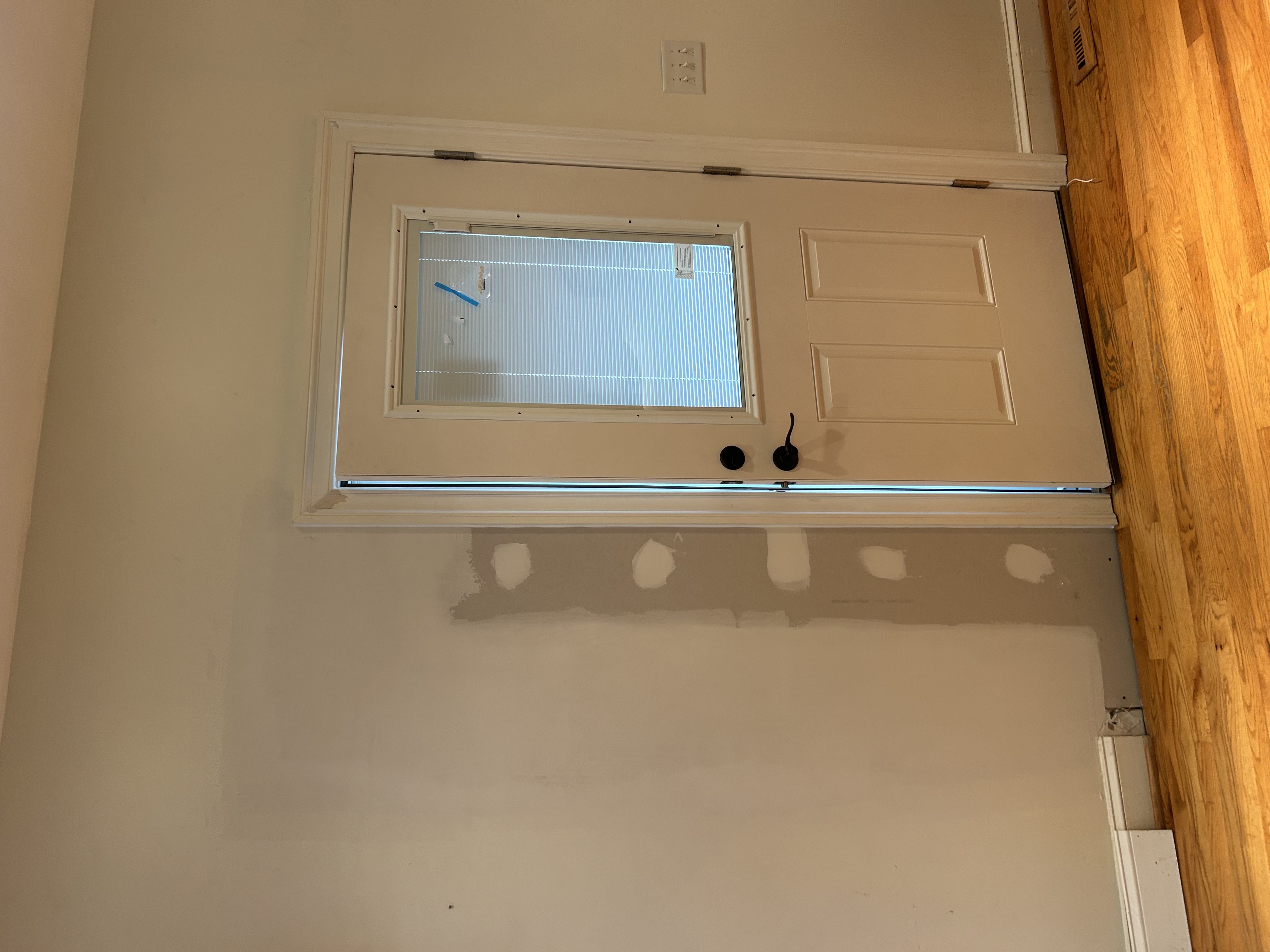 New storm door installation, interior view