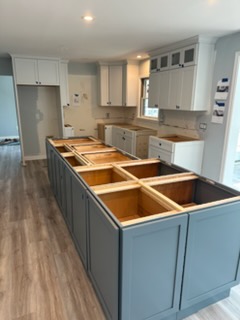 Kitchen remodel in progress with new cabinetry being installed