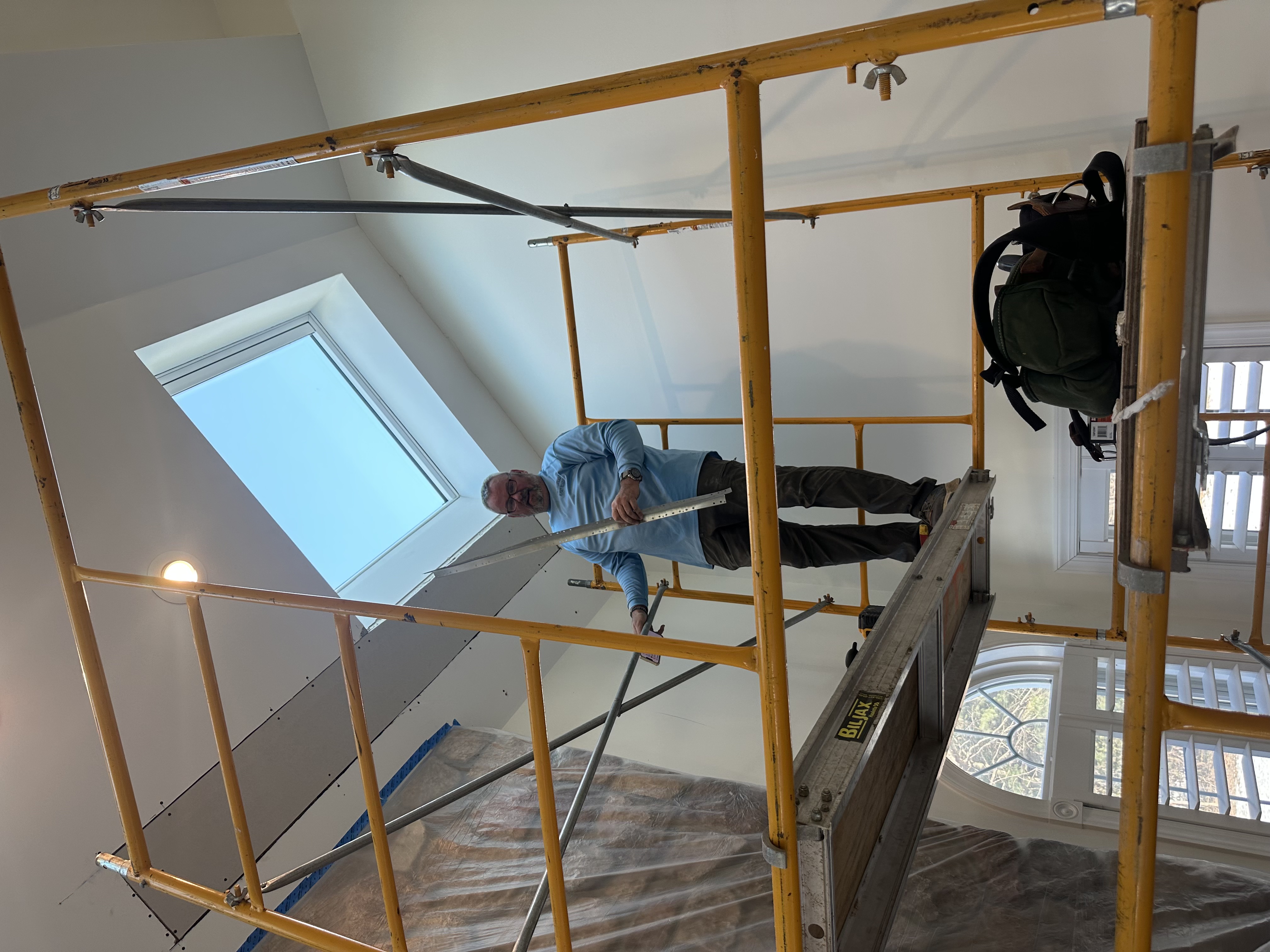 Evans Brothers Construction crew member installing a skylight